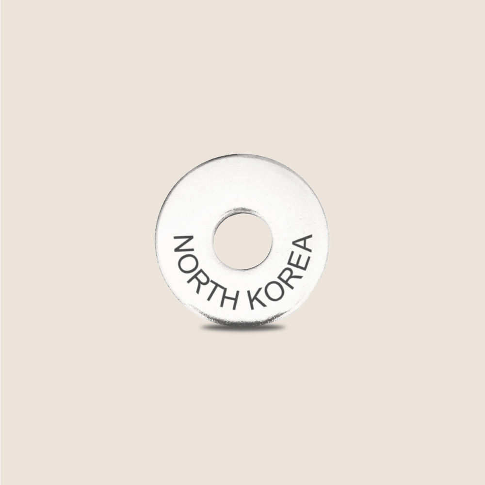 Engraved North Korea Country Token to remember your holiday, adding it to your travel keychain to make the perfect keepsake.