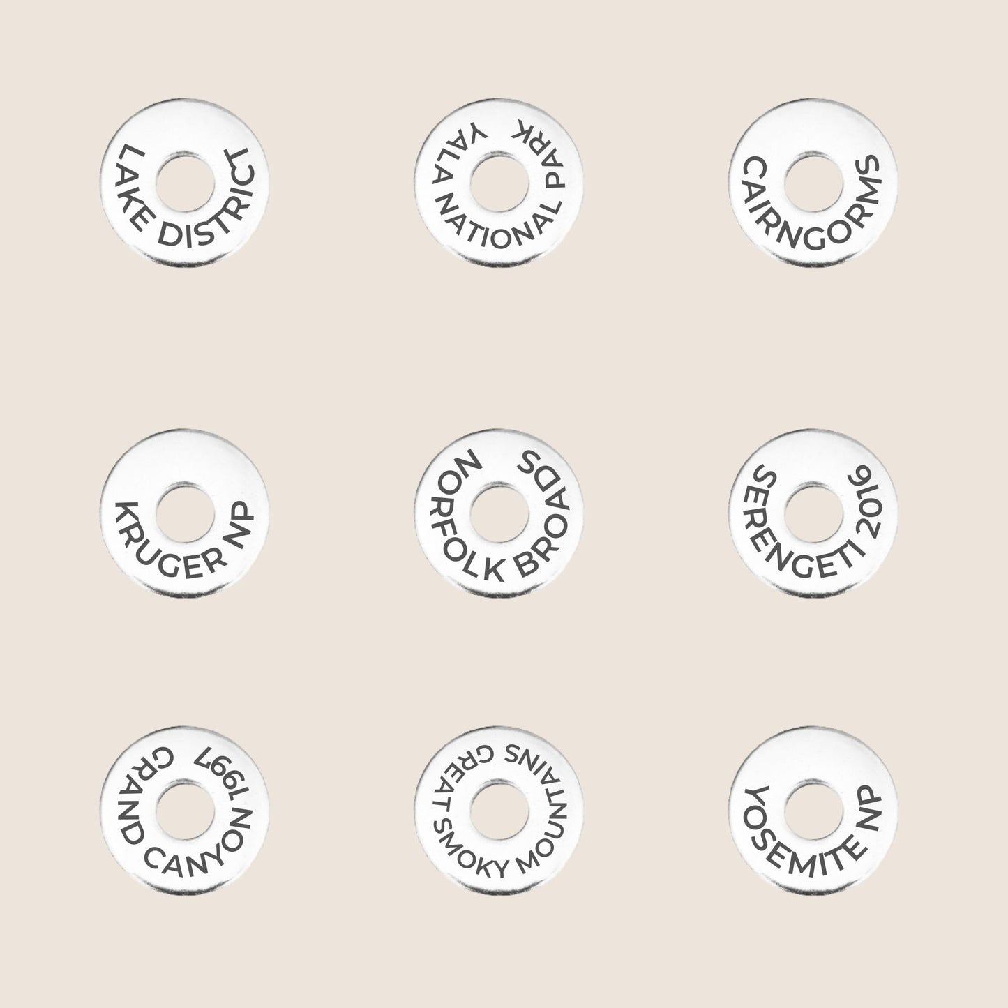 examples of National Parks engraved on travel tokens, perfect gift for hikers