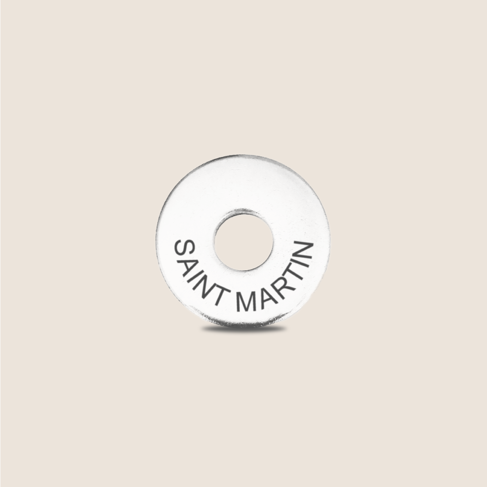 Engraved Saint Martin Country Token to remember your holiday, adding it to your travel keychain to make the perfect keepsake.