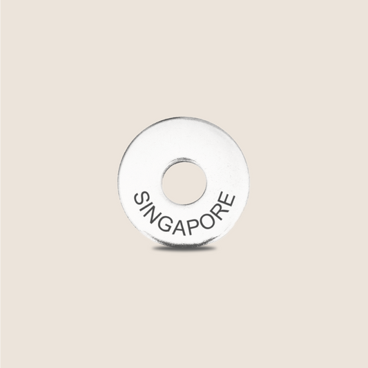 Engraved Singapore Country Token to remember your holiday, adding it to your travel keychain to make the perfect keepsake.