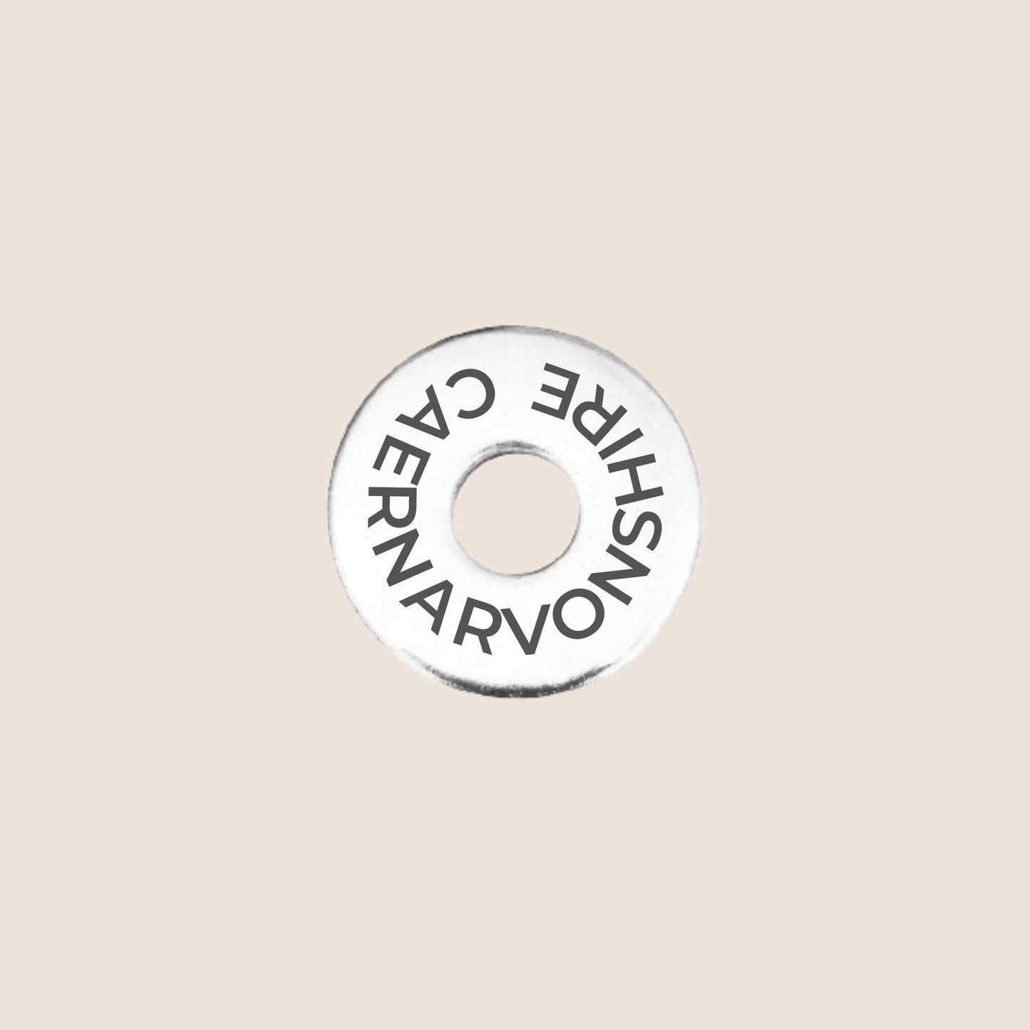 Engraved stainless steel token for each UK County visited, this token is engraved with Caernarvonshire.