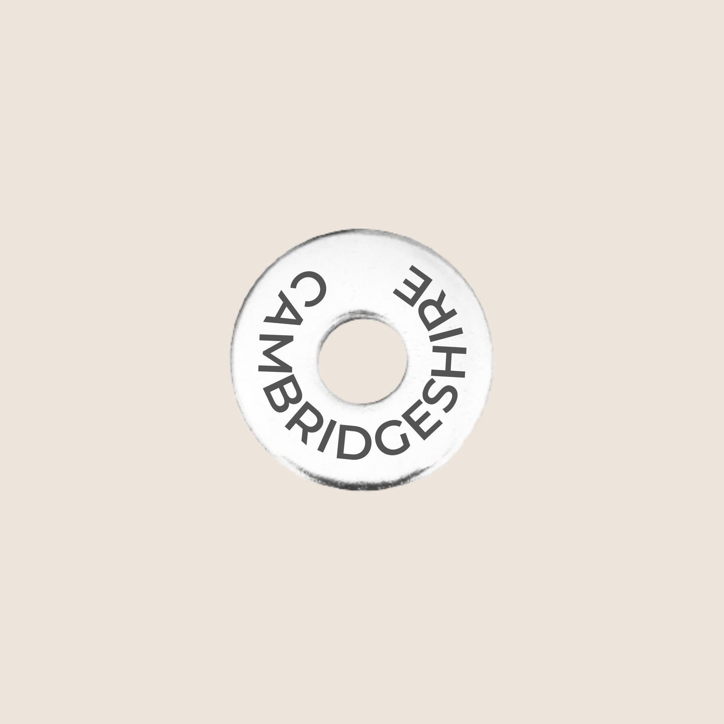 Engraved stainless steel token for each UK County visited, this token is engraved with Cambridgeshire.