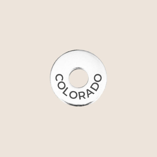 Engraved Colorado US State Token in stainless steel to add to your travel keepsake collection for your USA adventures.