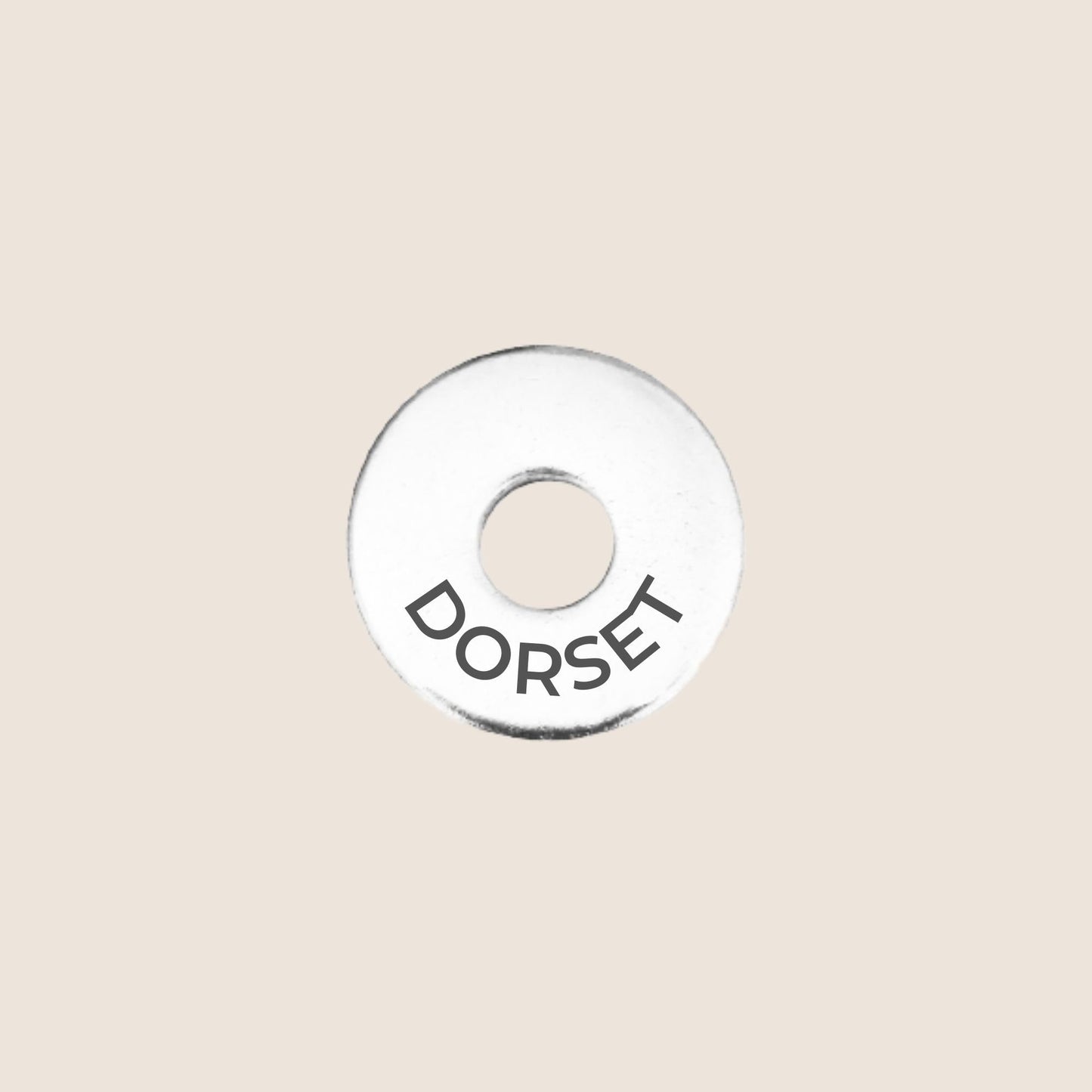 Engraved stainless steel token for each UK County visited, this token is engraved with Dorset.
