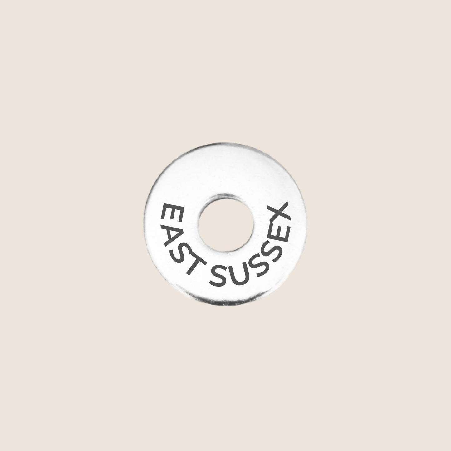Engraved stainless steel token for each UK County visited, this token is engraved with East Sussex.
