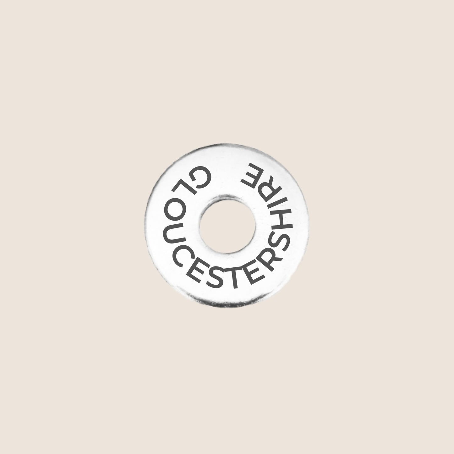 Engraved stainless steel token for each UK County visited, this token is engraved with Gloucestershire.