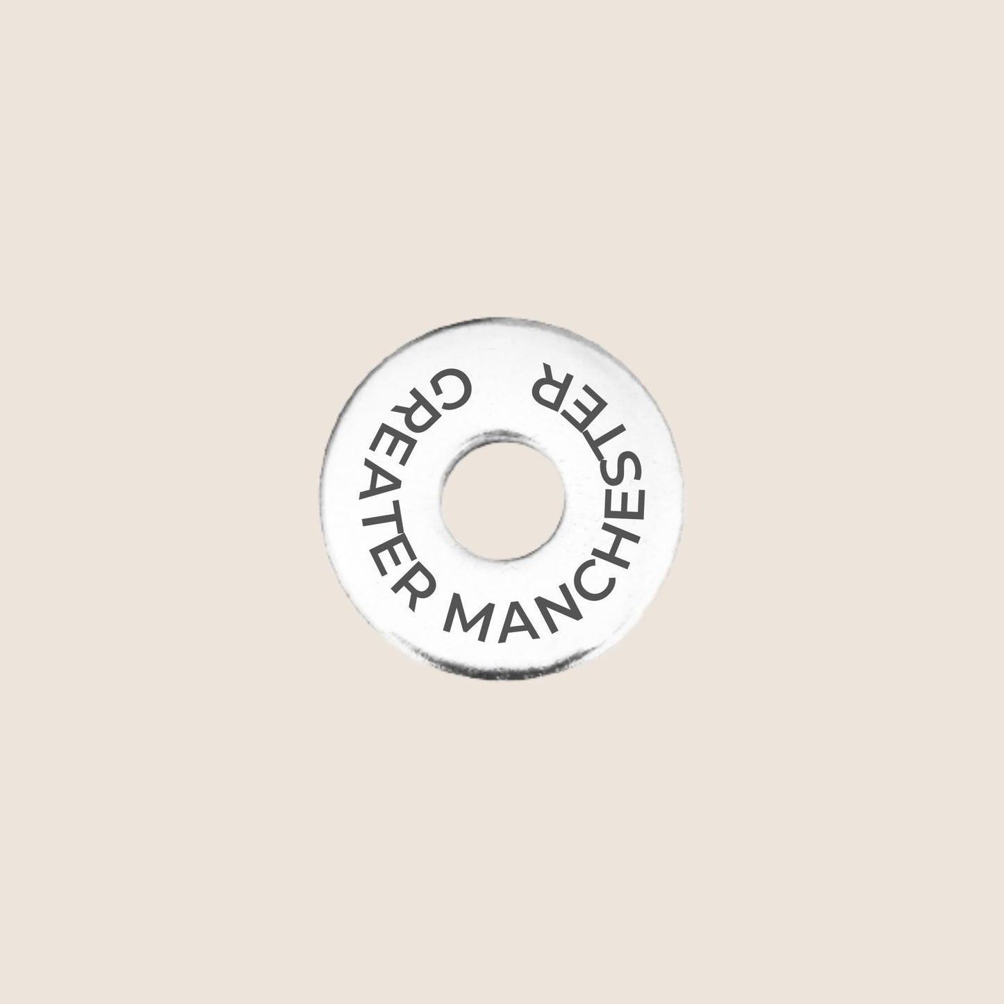 Engraved stainless steel token for each UK County visited, this token is engraved with Greater Manchester.