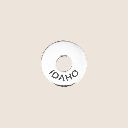 Engraved Idaho US State Token in stainless steel to add to your travel keepsake collection for your USA adventures.