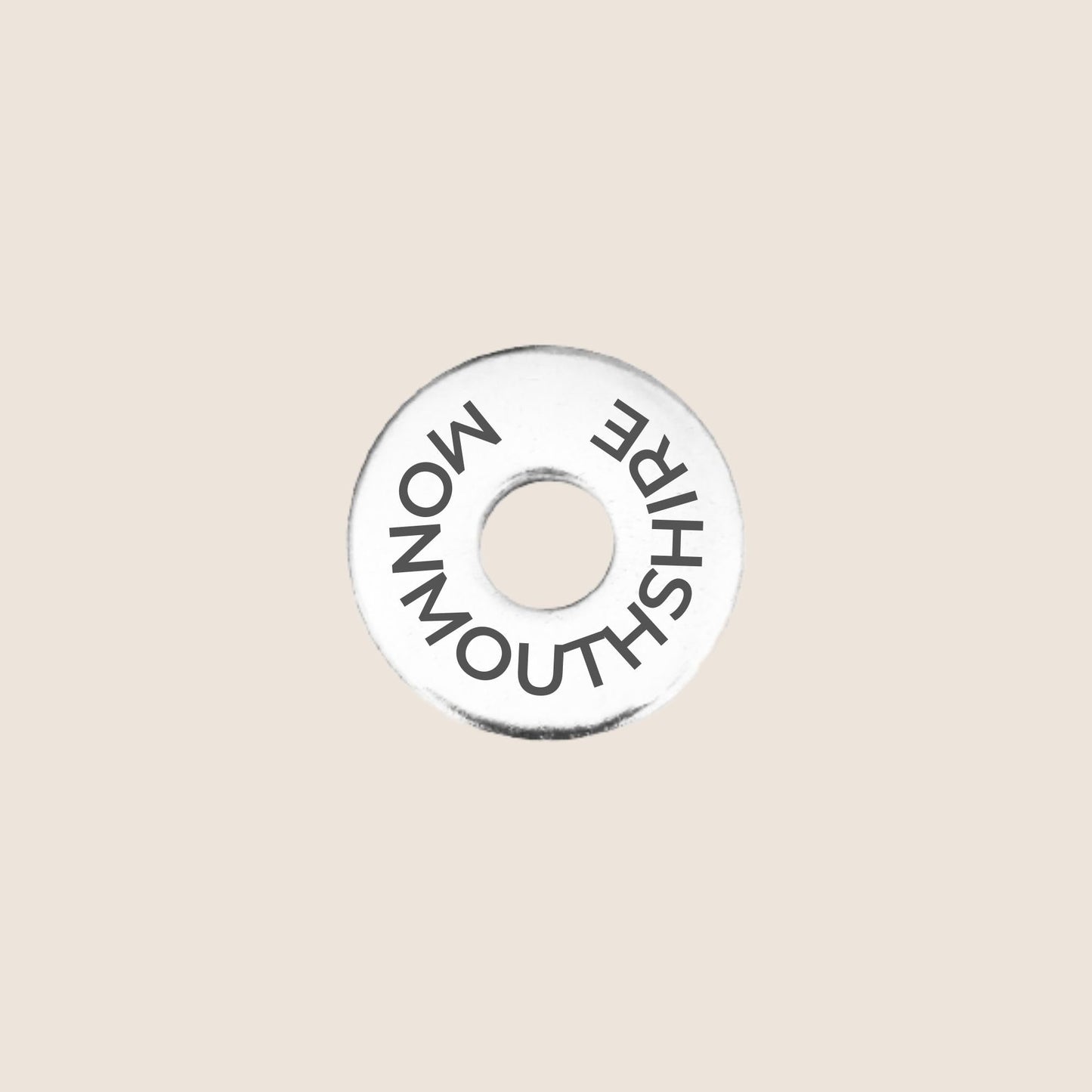 Engraved stainless steel token for each UK County visited, this token is engraved with Monmouthshire.