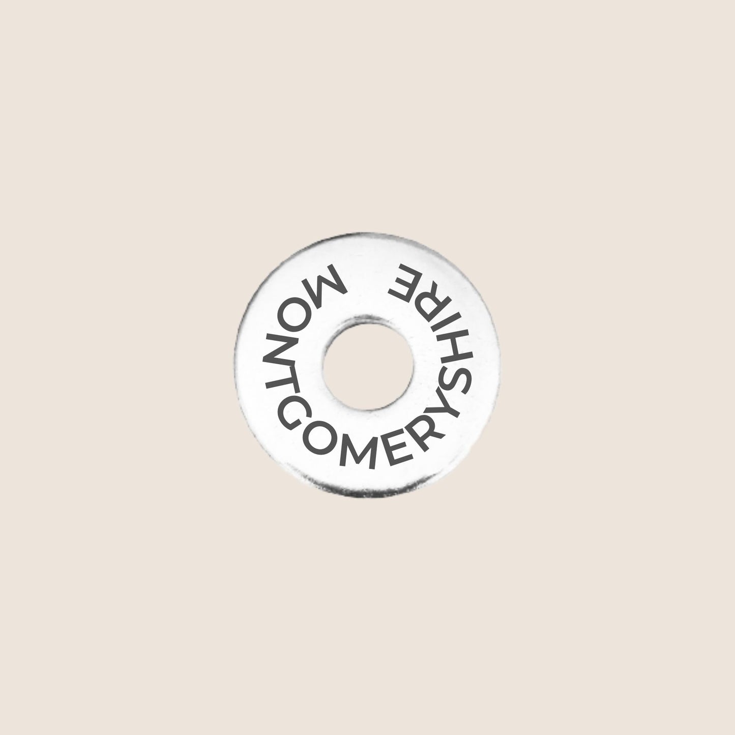 Engraved stainless steel token for each UK County visited, this token is engraved with Montgomeryshire.