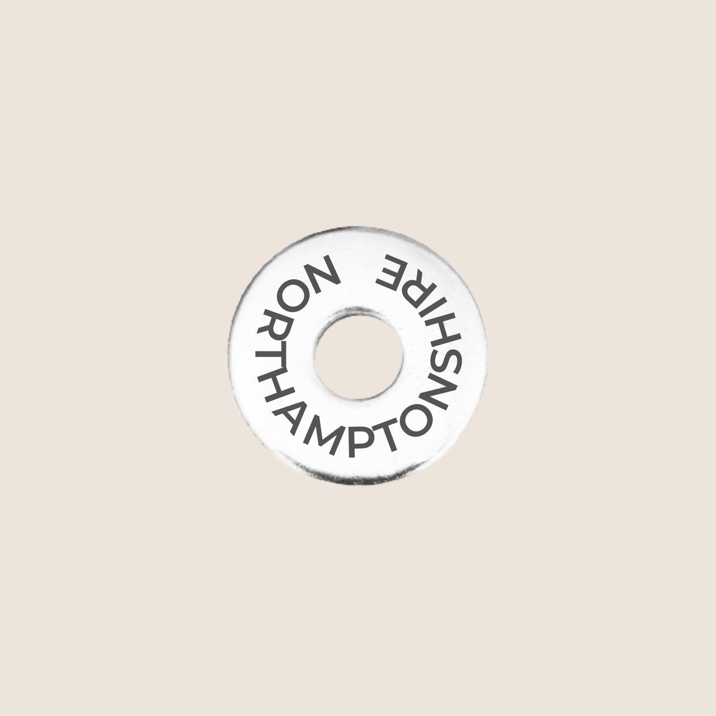 Engraved stainless steel token for each UK County visited, this token is engraved with Northamptonshire.