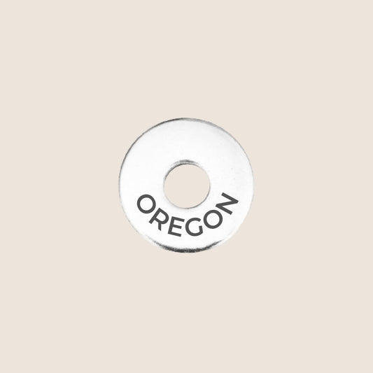 Engraved Oregon US State Token in stainless steel to add to your travel keepsake collection for your USA adventures.