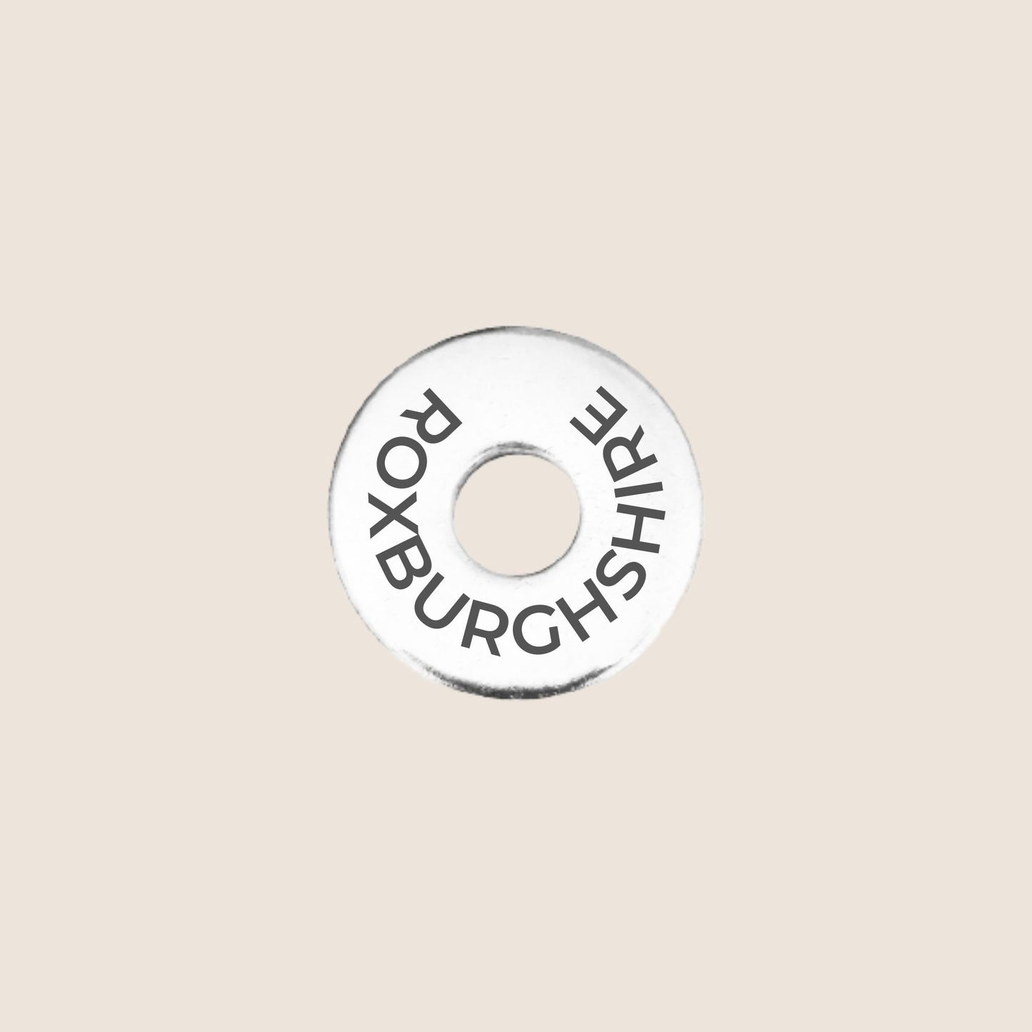 Engraved stainless steel token for each UK County visited, this token is engraved with Roxburghshire.