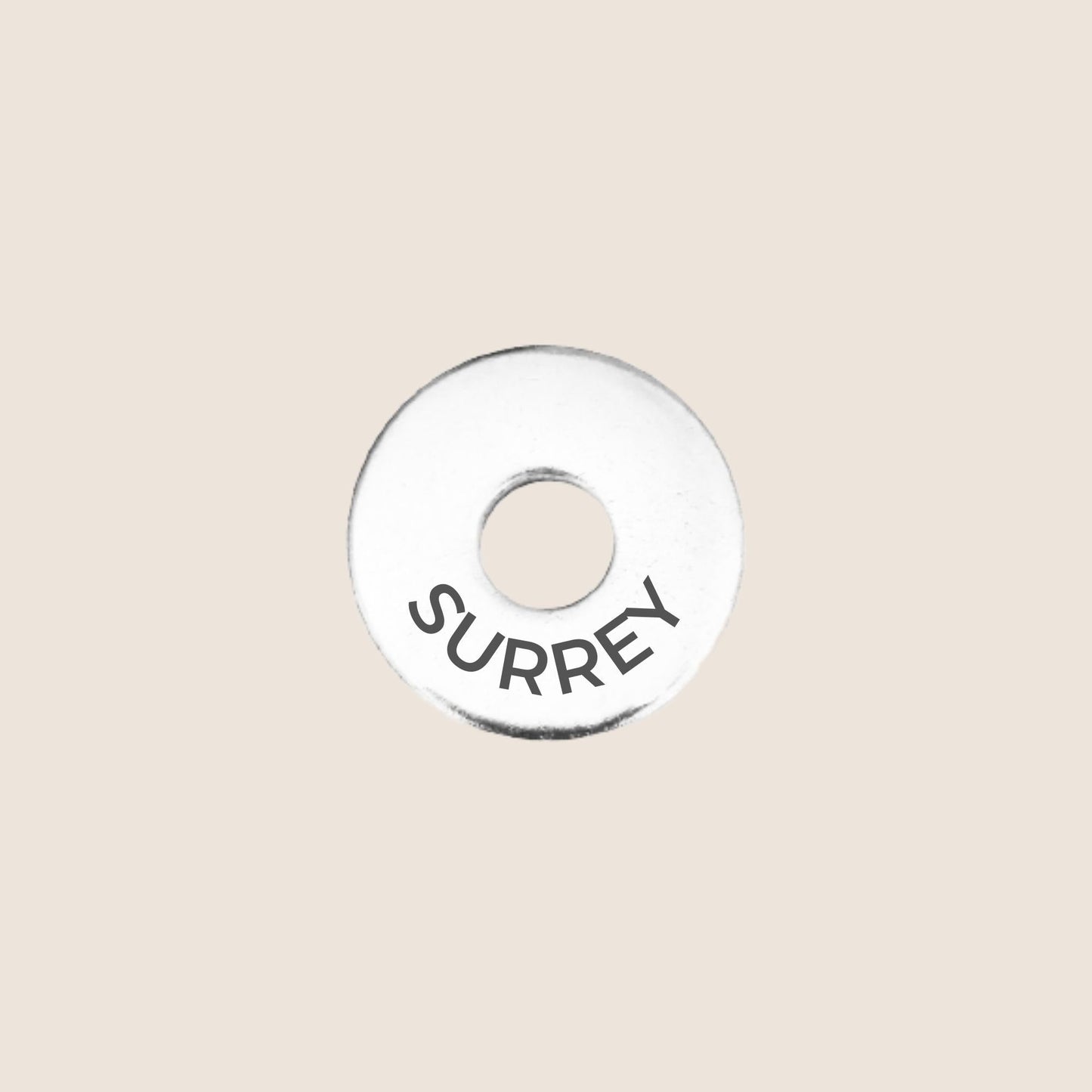 Engraved stainless steel token for each UK County visited, this token is engraved with Surrey.