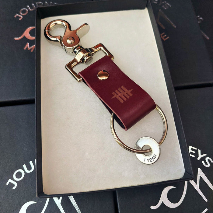 burgundy leather custom branded keyring for employee gifts at a US company