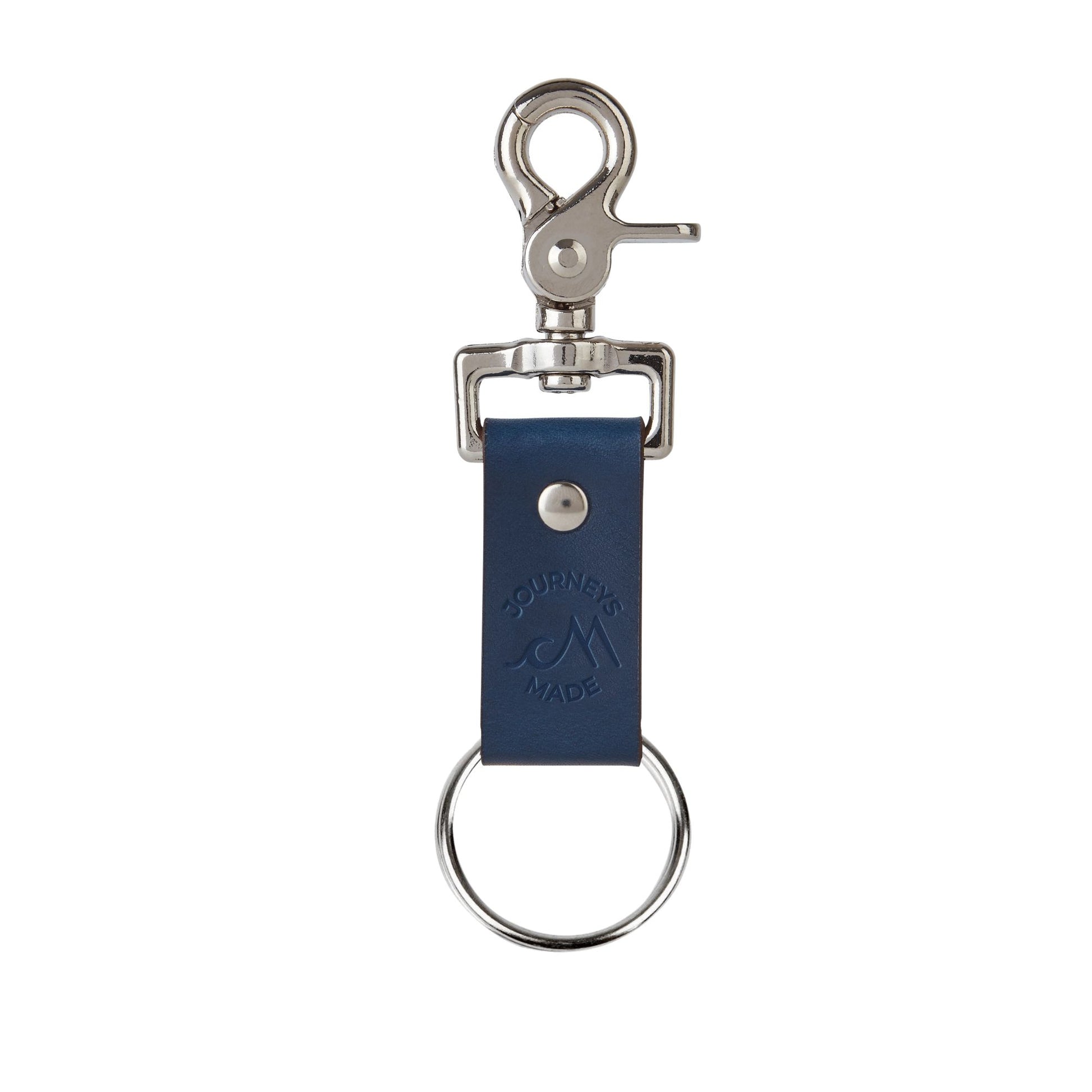 navy ocean blue travel keyring made of leather on a white background