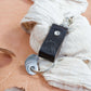 Dark brown travel keyring made of vegetable-tanned leather, perfect travel gift for adventurers.