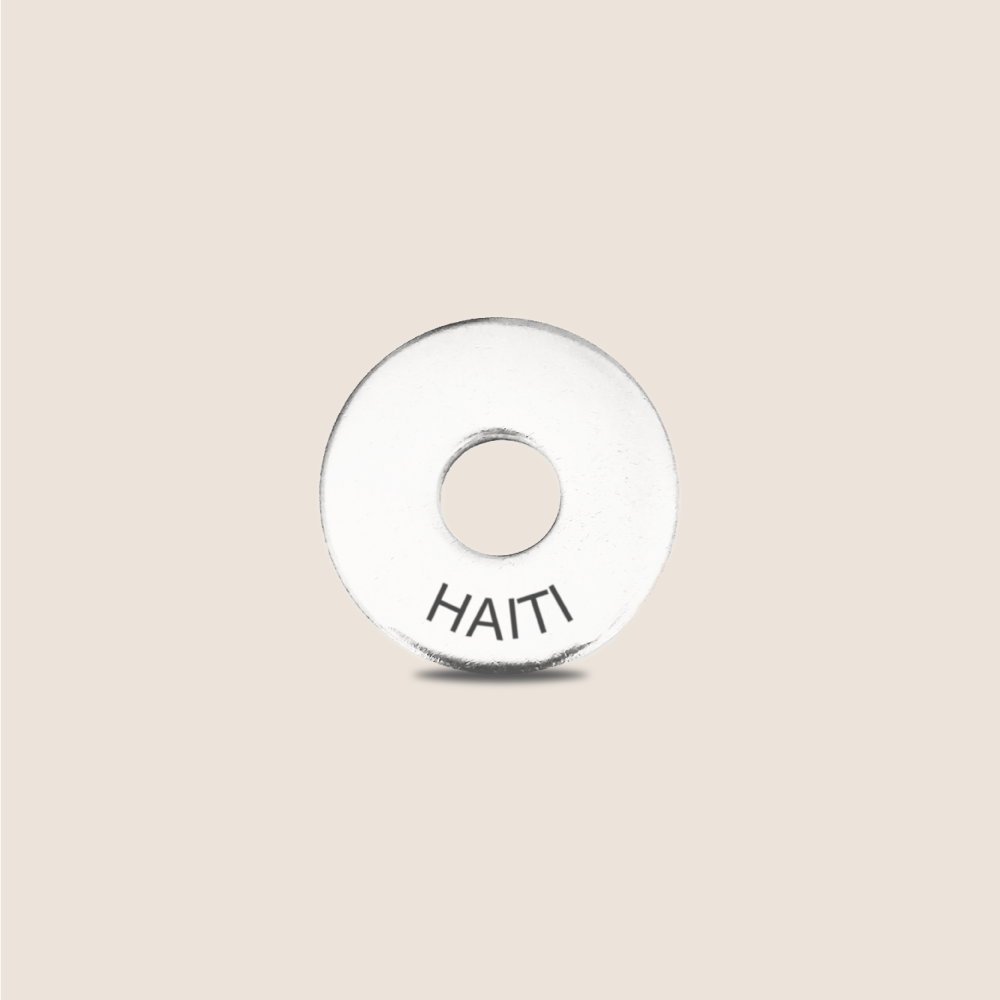 Engraved Haiti Country Token to remember your holiday, adding it to your travel keychain to make the perfect keepsake.