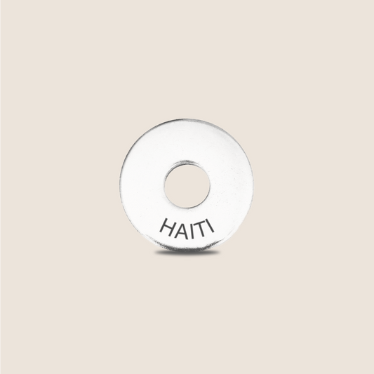 Engraved Haiti Country Token to remember your holiday, adding it to your travel keychain to make the perfect keepsake.