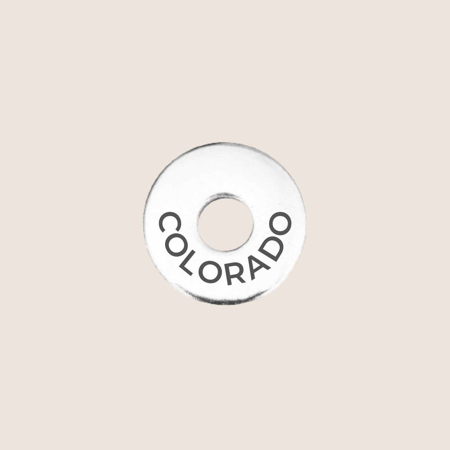 Engraved Colorado US State Token in stainless steel to add to your travel keepsake collection for your USA adventures.