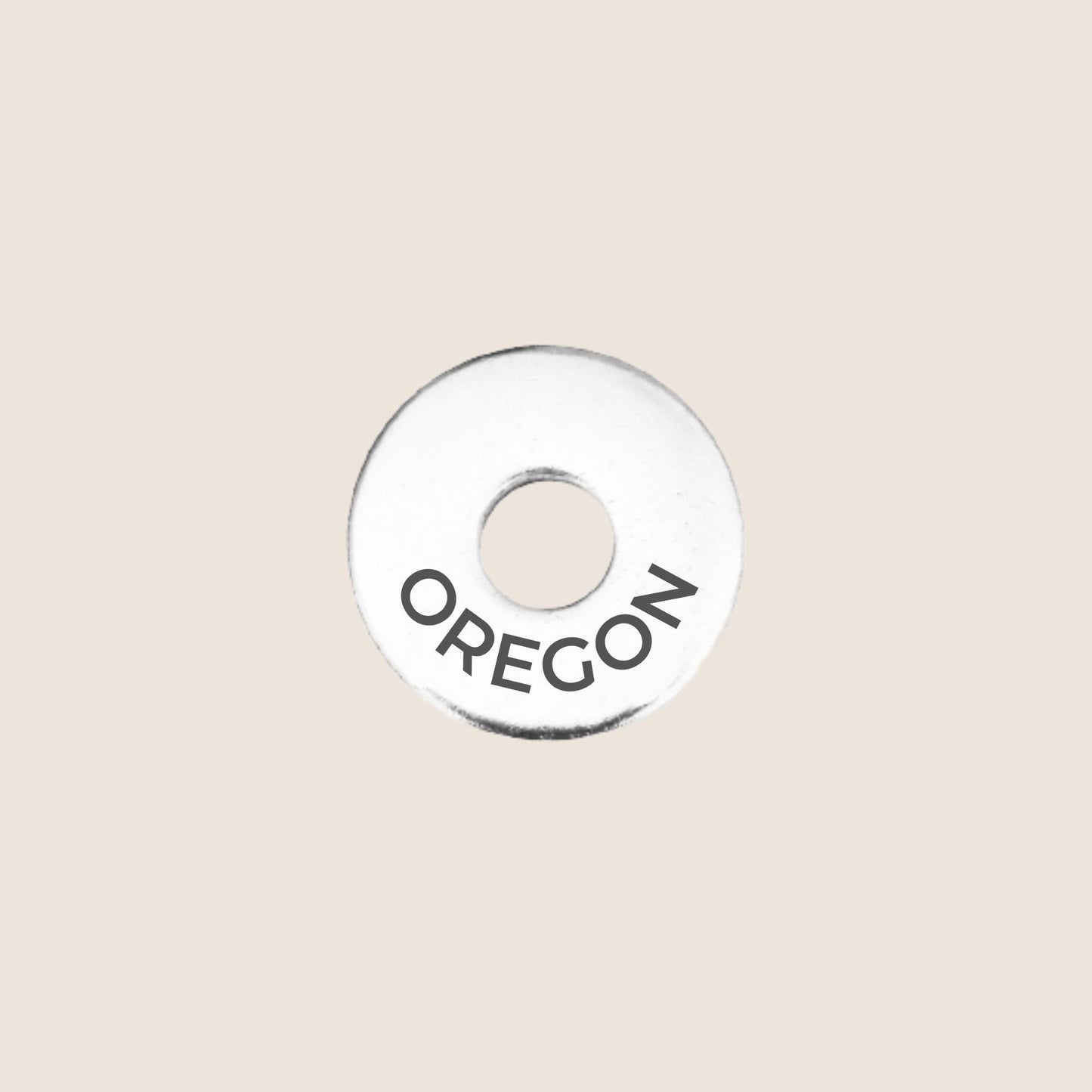 Engraved Oregon US State Token in stainless steel to add to your travel keepsake collection for your USA adventures.